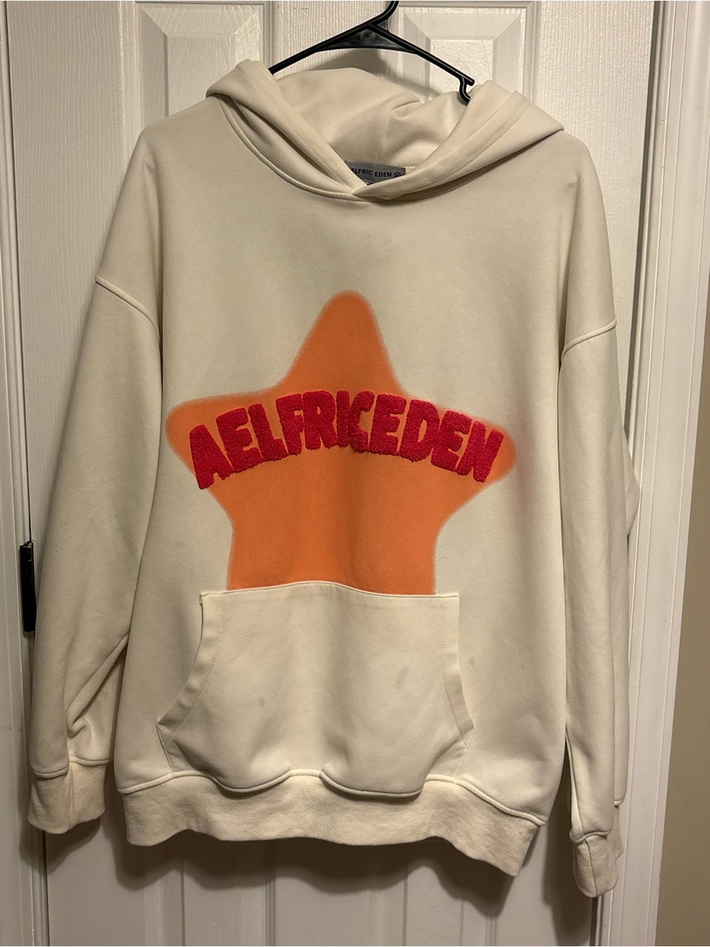 Aelfric Eden Cream Crewneck Hoodie with Orange Star and Red Logo